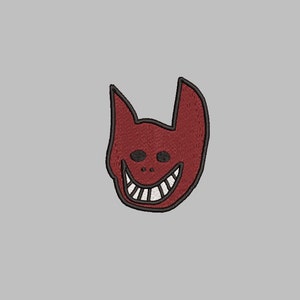 Puede incluir: Parche bordado rojo con una cara de diablo de dibujos animados con una amplia sonrisa y ojos negros.