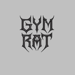 May include: Black embroidered text on a gray background reads "GYM RAT" in a gothic font. The letters are stylized with sharp, pointed serifs, giving a bold and edgy appearance. The design is centered.