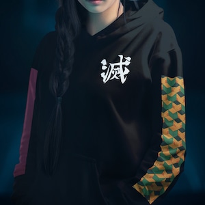 May include: Black hoodie with a white Japanese character "Breath" on the front and a green and yellow geometric pattern on the sleeve.