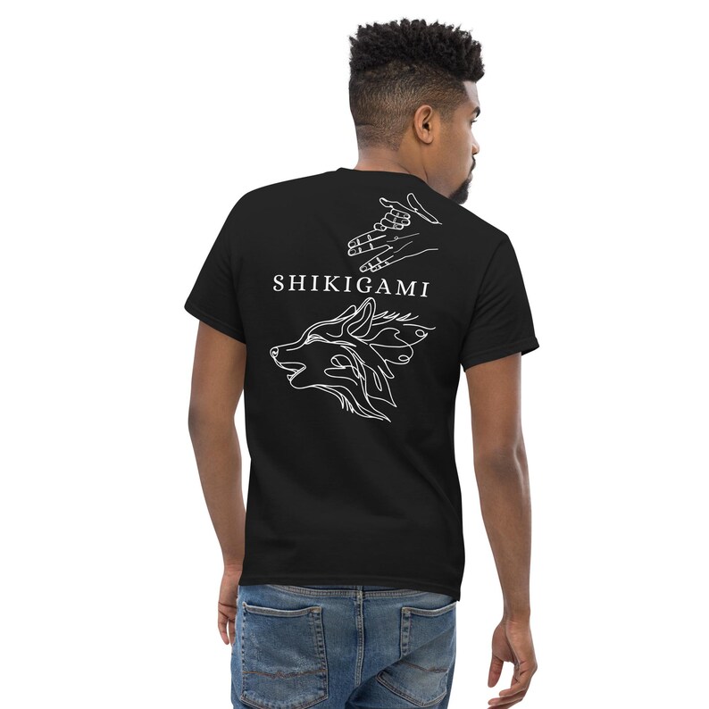 May include: Black t-shirt with a white wolf illustration and the text "SHIKIGAMI" on the back.