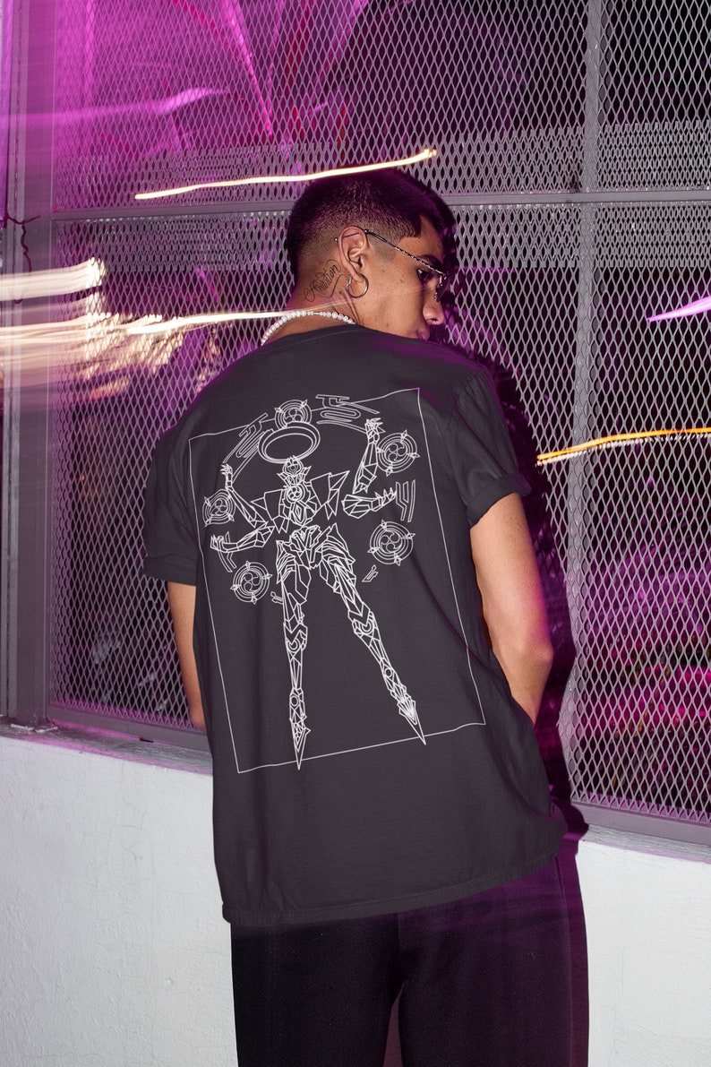 May include: A black t-shirt with a white graphic of a robot with multiple arms and a halo. The robot is surrounded by circles.