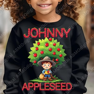 May include: Black sweatshirt with a red apple tree graphic and the text "JOHNNY APPLESEED". A cartoon character is picking apples from the tree.