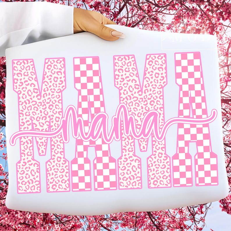 May include: A white rectangular sign with the word "MAMA" in pink. The letters alternate between a leopard print and a pink and white checkerboard pattern. The word "mama" is written in cursive below the word "MAMA".