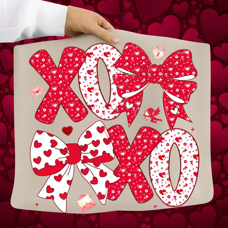 May include: A beige pillow with the letters "XOXO" in red, decorated with heart patterns and bows. The design includes a small cupid, a heart-shaped lock, and tiny envelopes, perfect for Valentine's Day or a romantic gift.