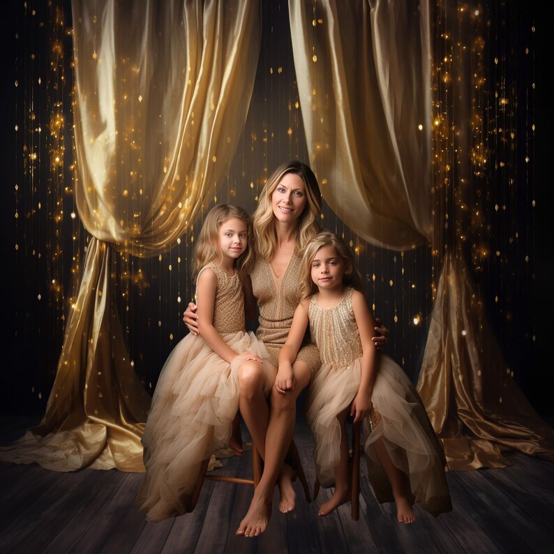 May include: A mother and her two daughters pose in front of a gold curtain backdrop with sparkling lights. They are all wearing gold sequined dresses. The mother is holding her youngest daughter's hand.