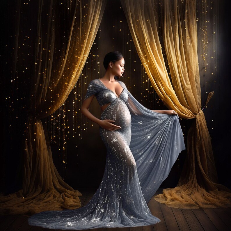 May include: A pregnant woman wearing a sparkly, light blue gown with a sheer overlay. She is standing in front of a backdrop of gold fabric with shimmering lights.