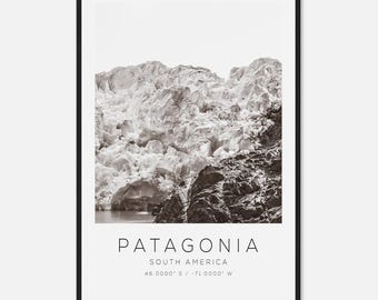 May include: Black and white framed print featuring a glacier in Patagonia, South America. The image shows a large, textured glacier with the text "PATAGONIA" and geographical coordinates at the bottom.