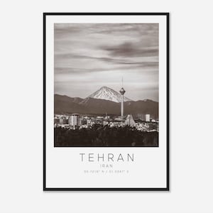 May include: A black and white photograph of the Tehran skyline with the Milad Tower in the foreground and a mountain in the background. The text "TEHRAN, IRAN, 35.7219° N / 51.3347° E" is printed below the image.