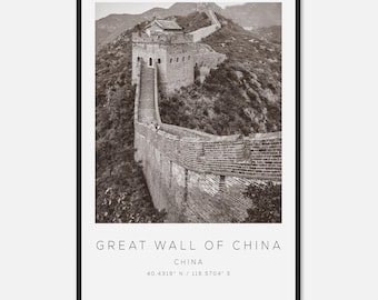 May include: Black and white framed print of the Great Wall of China. The image shows the wall winding through a mountainous landscape. Text at the bottom reads "GREAT WALL OF CHINA" and "CHINA" with coordinates.