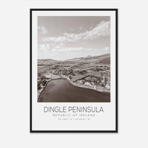 May include: A black and white aerial photograph of the Dingle Peninsula in Ireland. The photo shows a coastal town with a bay and surrounding countryside. The text "Dingle Peninsula, Republic of Ireland, 52.1931° N / 10.0831° W" is printed below the image.