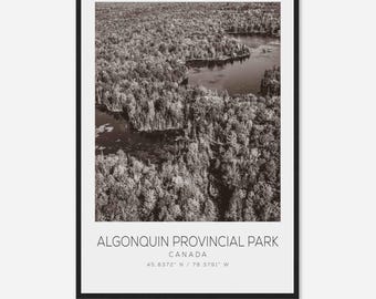 May include: An aerial view of Algonquin Provincial Park in Canada. The image shows a black and white photograph of a forest with a lake in the center. The text "ALGONQUIN PROVINCIAL PARK CANADA 45.8372° N / 78.3791° W" is at the bottom of the image.