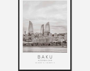 May include: A black and white photograph of the Baku skyline in Azerbaijan. The photo features the Flame Towers, three skyscrapers shaped like flames, and other buildings in the city. The text "BAKU AZERBAIJAN 40.4093° N / 49.8671° E" is printed below the image.