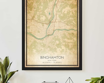 May include: A vintage-style map print of Binghamton, New York, with a black frame. The map is in shades of green, brown, and beige, with a river running through the center. The city name and coordinates are printed at the bottom of the map.