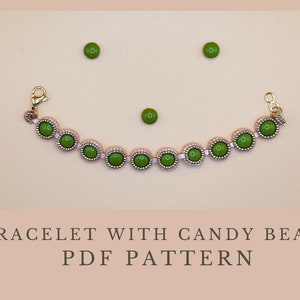 May include: A gold bracelet with green candy beads and a clasp. The bracelet is on a light beige surface. The text "BRACELET WITH CANDY BEADS PDF PATTERN" is below the bracelet.