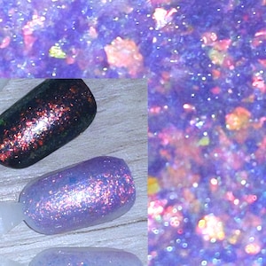 May include: Close-up of three nail polish samples in shades of purple, blue, and black, each with glitter. The top section shows a blurred, abstract view of purple and orange glitter. The nail polish samples are on white sticks.