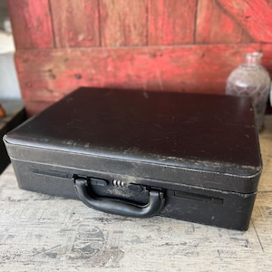 May include: A set of three ceramic mugs with a speckled, matte finish. The mugs are in shades of cream, light gray, and dark gray. Each mug has a simple, modern design and a rounded handle.