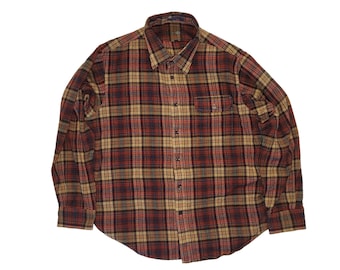 May include: A long-sleeved plaid shirt with a button-down collar and a chest pocket. The shirt is made of a soft, comfortable fabric and has a relaxed fit.