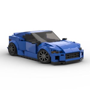May include: A blue toy car constructed from interlocking plastic bricks. The model features a sleek design with black wheels and a dark windshield. The car is a coupe style and sits on a white background.