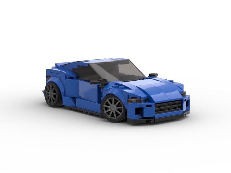 May include: A blue toy car constructed from interlocking plastic bricks. The model features a sleek design with black wheels and a dark windshield. The car is a coupe style and sits on a white background.