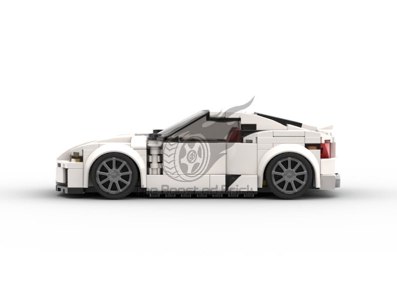 May include: A white sports car model made of interlocking blocks. The car features black wheels, a sleek design, and a logo on the side. The model has a spoiler and a tinted windshield. The car is set against a white background.