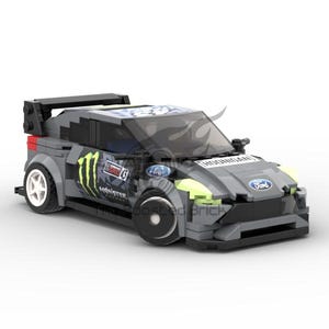 May include: A gray and black Lego Ford Fiesta rally car with Monster Energy and Ford logos. The car has a black spoiler and a green Monster Energy logo on the side.