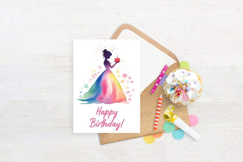 May include: A white card with a watercolor illustration of a woman in a rainbow dress holding a small red cake with a single candle. The text "Happy Birthday!" is written in pink below the illustration.
