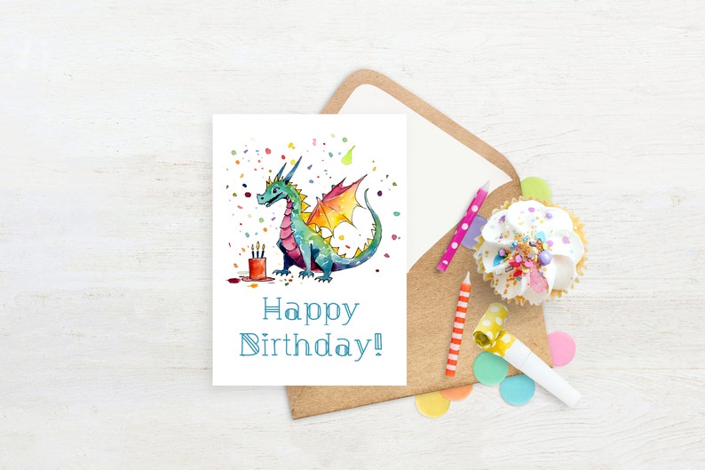 May include: A watercolor illustration of a green, blue, and orange dragon with a red candle on a cake. The dragon is surrounded by confetti and the text "Happy Birthday!" is written below the dragon.