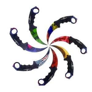 May include: A set of eight black karambit knives with different colorful designs. The knives have a curved blade and a finger ring. The designs include a shark, a dragon, camouflage, and a rainbow.