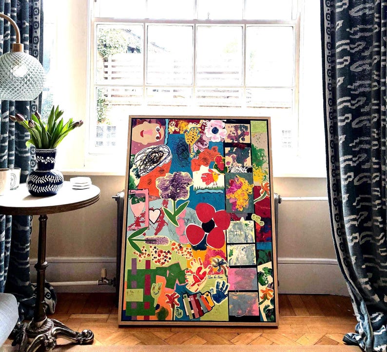 May include: A rectangular framed artwork featuring a vibrant collage of colorful abstract shapes, floral motifs, handprints, and whimsical illustrations in shades of red, blue, green, yellow, and pink, set against a bright turquoise background.