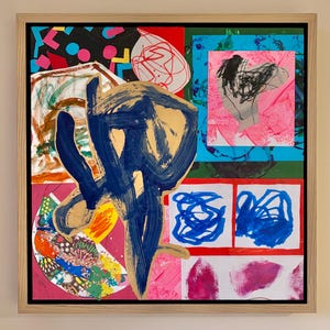 May include: A framed mixed-media collage painting featuring a large, central dark blue and gold brushstroke overlay. The composition includes various colorful sections with abstract shapes, scribbles, geometric patterns, and vibrant pink, red, and blue paint.