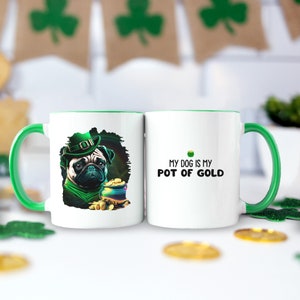 May include: White ceramic mug with a green rim. One side features a pug wearing a green leprechaun hat and holding a pot of gold. The other side says "My dog is my pot of gold".