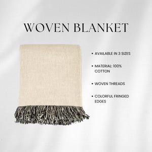 May include: A woven cotton blanket with a fringed edge. The blanket is beige with black and white fringe. The text "WOVEN BLANKET" is at the top of the image. The text "AVAILABLE IN 3 SIZES", "MATERIAL: 100% COTTON", "WOVEN THREADS", and "COLORFUL FRINGED EDGES" is listed below the image.