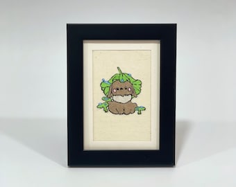 Lapin avec une feuille brodée à la main