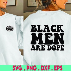 May include: White sweatshirt with the text "BLACK MEN ARE DOPE" in black, bold, retro font on the back. A smaller version of the text is on the front. The bottom of the image has the text "SVG . PNG . DXF . EPS".