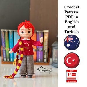 May include: A handmade crochet doll with red hair, wearing a red sweater with a yellow "R", gray pants, and a striped scarf. The doll is standing in front of a bookshelf. Text on the image says "Crochet Pattern PDF in English and Turkish".