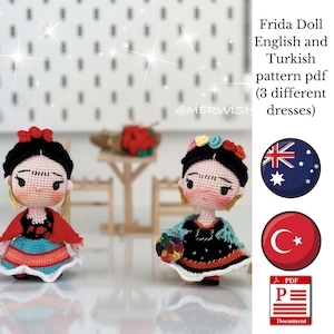 May include: Two crocheted Frida Kahlo dolls wearing different colorful dresses. The dolls are holding flowers and paint palettes. The image includes text that says "Frida Doll English and Turkish pattern pdf (3 different dresses)" and includes flags for Australia and Turkey.