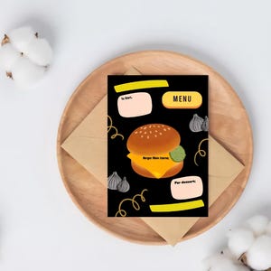 May include: A black menu card with a burger illustration, text, and decorative elements. The card is on a wooden plate with an envelope, surrounded by cotton buds. The menu includes sections for starters, main course, and dessert.