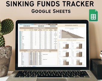 May include: A laptop computer displaying a Google Sheets spreadsheet titled "Sinking Funds Tracker". The spreadsheet includes a savings tracker, a contributions entry and journal, and progress charts. The total savings goal is $120,500.00, the total saved so far is $62,450.00, and the amount left to go is $58,050.00.