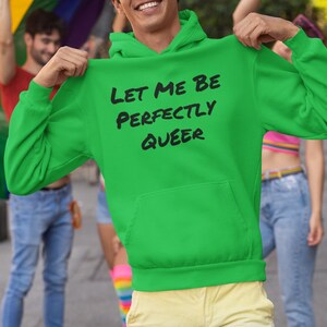 May include: A bright green hoodie with a black print that says "Let me be perfectly queer".
