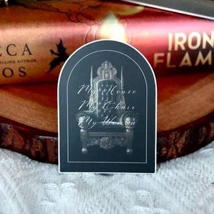 May include: A black and white sticker with an arched top. The sticker features a detailed illustration of a throne with the text "My House My Chair My Women" written in a cursive font.