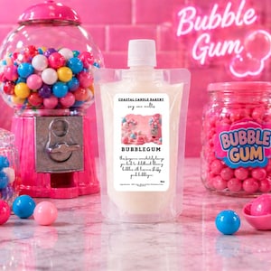 May include: A pink gumball machine, jars of pink bubble gum, and a pouch of bubble gum scented wax melts are arranged on a pink surface. A neon sign reads "Bubble Gum". The wax melt pouch has the text "Bubblegum" and "Coastal Candle Bakery".