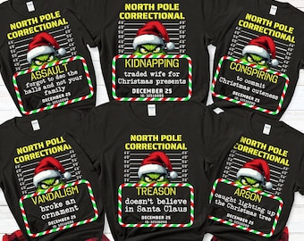 May include: Black crew neck t-shirts with Grinch-themed designs. Each shirt features a Grinch wearing a Santa hat and a sign with a Christmas-related crime, such as "Assault" or "Kidnapping".