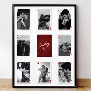 May include: A framed wall art piece featuring nine playing card-style prints. Eight cards display black and white photographs of couples, while the central card is red with the text "Lucky Us" in white script. The frame is black.