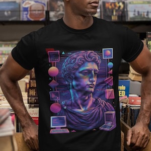 Op de afbeelding: Een set van drie keramische mokken met een gespikkelde, matte afwerking. De mokken zijn in crème, lichtgrijs en donkergrijs. Elke mok heeft een eenvoudig, minimalistisch ontwerp.