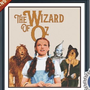 May include: A cross stitch pattern for "The Wizard of Oz" featuring Dorothy, the Scarecrow, the Tin Man, and the Cowardly Lion. The pattern is in a black frame with a white background. The title "The Wizard of Oz" is in gold lettering.