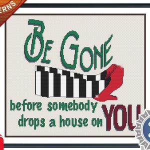 May include: Cross stitch pattern featuring the Wicked Witch of the West's iconic red shoes and the text "Be Gone before somebody drops a house on you!"  The pattern is labeled "Be Gone" and includes a "Tested" badge.