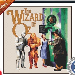 May include: Cross stitch pattern for "The Wizard of Oz" featuring Dorothy, the Scarecrow, the Tin Man, and the Cowardly Lion standing in front of the Emerald City gates. The pattern is titled "At the Gates".