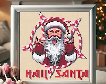 May include: A cross-stitch pattern featuring a cartoon Santa Claus with a tongue sticking out, wearing a red and white suit and making the devil horns hand gesture. The background is a white and red candy cane design with the text "HAIL SANTA" in a metal font.