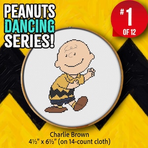 May include: A cross-stitch of Charlie Brown from the Peanuts series, in a wooden hoop. The image shows Charlie Brown dancing, wearing a yellow shirt and blue shorts. The text reads "PEANUTS DANCING SERIES!" and "#1 OF 12". The cross-stitch measures 4.5" x 6.5".
