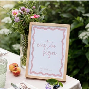 Letrero personalizado para baby shower de niña en color rosa bohemio con texto y borde ondulado, plantilla de lienzo editable DIY, decoración con chispas para bebé, despedida de soltera imprimible BB86